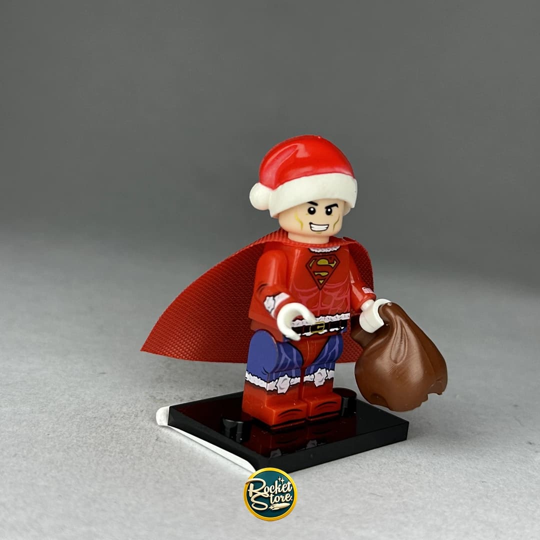 Minifigura tipo LEGO DC Comics Superman Navideño Santa con Saco